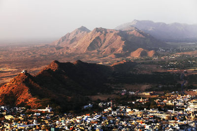 High angle view of residential district and mountains