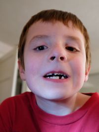 Portrait of boy showing gap tooth