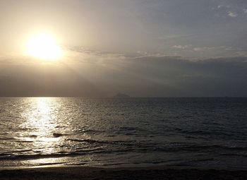 Scenic view of sea against sky at sunset