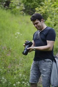 Young man photographing