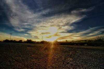 Scenic view of field against sky during sunset