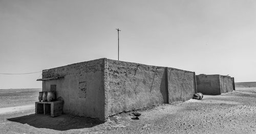 Built structure on desert of sudan  against clear sky
