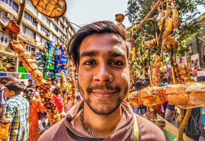 Portrait of smiling young man outdoors