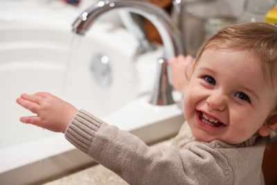 High angle view of cute baby boy in bathroom