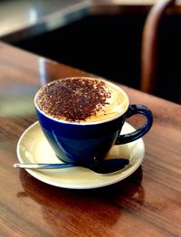 Close-up of cappuccino on table