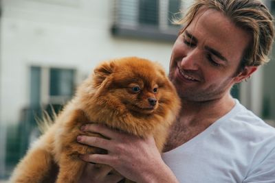 Portrait of man with dog