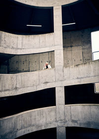 Low angle view of man on multi storey carpark