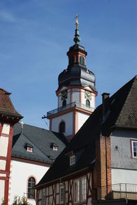 Low angle view of buildings in city against sky