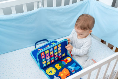 Boy playing with toy blocks