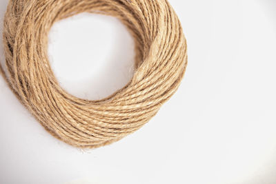 High angle view of rope over white background