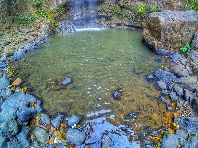 water, rock - object, stream, tranquility, beauty in nature, nature, scenics, river, tranquil scene, flowing water, reflection, flowing, stone - object, rock, stone, lake, rock formation, high angle view, day, outdoors