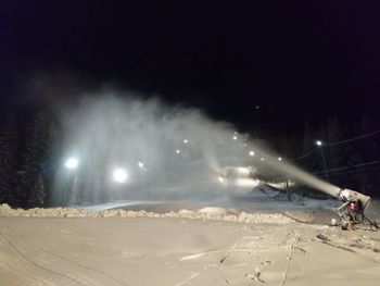 Panoramic view of snow covered landscape at night