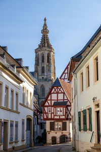 Cobbled road with historic houses and schlosskirche in meisenheim, rhineland-palatinate, germany