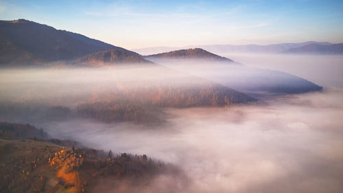 Scenic view of mountains against sky during sunset