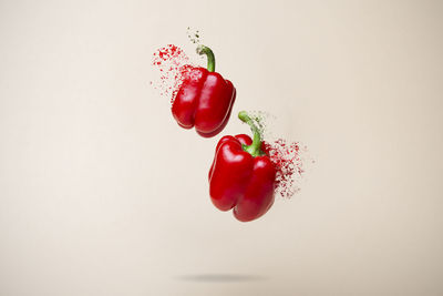 Close-up of red berries against white background