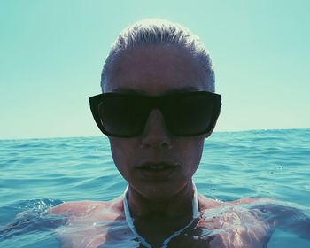 Portrait of young woman in sea