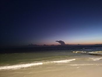 Scenic view of sea against clear sky during sunset