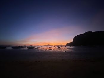 Scenic view of sea against sky at sunset