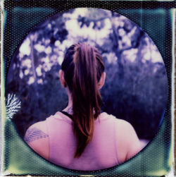 Rear view of woman sitting in mirror