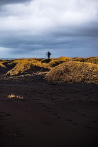 Man on beach against sky