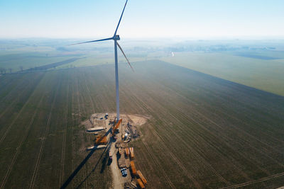 Construction site near windmill turbine, wind generator installing