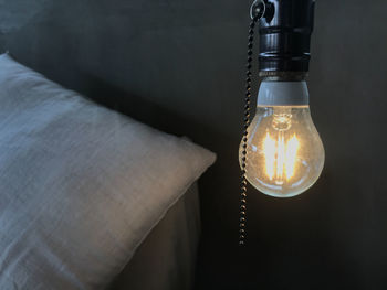 Close-up of illuminated light bulb