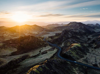 Scenic view of mountains against sky during sunset