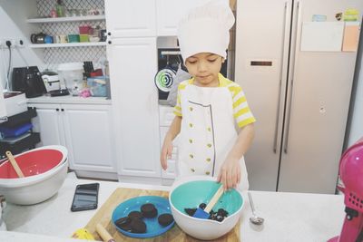 Full length of boy standing in bowl