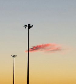 Low angle view of street light against sky