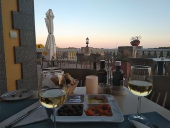 Food on table against sky during sunset