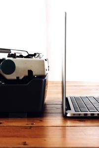 Close-up of laptop on table at home