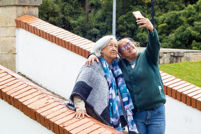 Group of women travelling. famous historic bridge of boyaca in colombia. colombian independence .