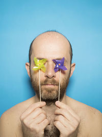 Portrait of man against blue background