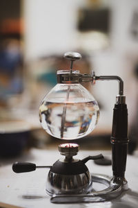 Close-up of glass container above stove