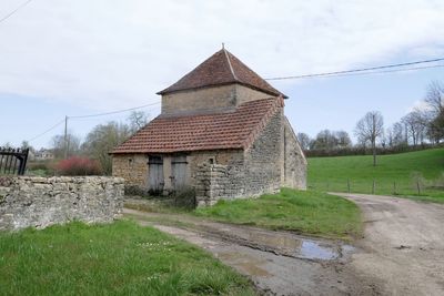 House on field against sky