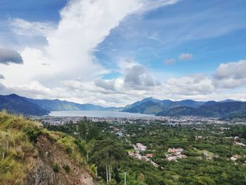Scenic view of landscape and mountains against sky
