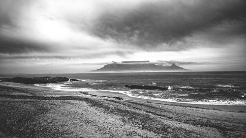 Scenic view of sea against cloudy sky