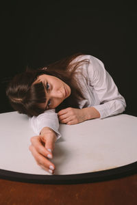 Full length of naked woman against gray background