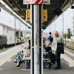 People on railroad station platform