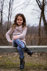 Portrait of girl sitting on playground