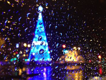 Close-up of illuminated christmas tree at night