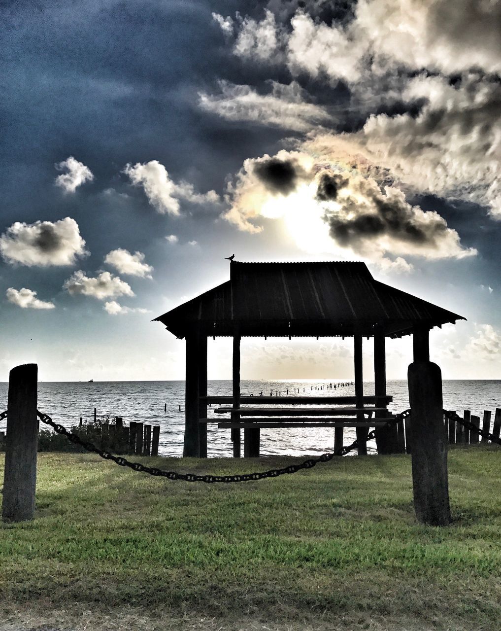 PIER ON SEA AGAINST SKY