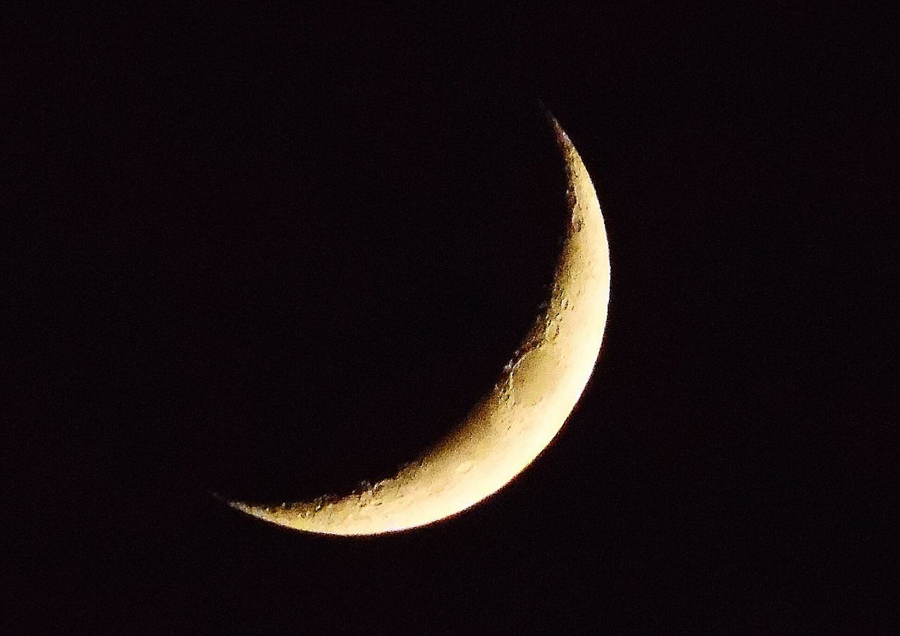 LOW ANGLE VIEW OF HALF MOON IN SKY AT NIGHT