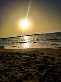 Scenic view of sea against sky at sunset