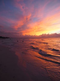 Scenic view of sea against sky at sunset