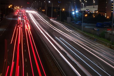 High angle view of light trails on road at night