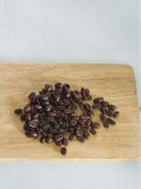 Close-up of coffee beans on table