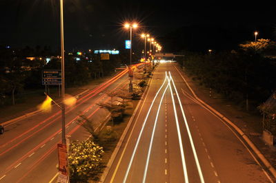 High angle view of light trails on road at night