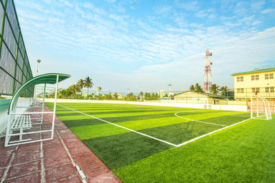 Scenic view of soccer field against sky