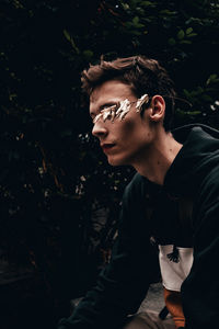 Portrait of young man looking away